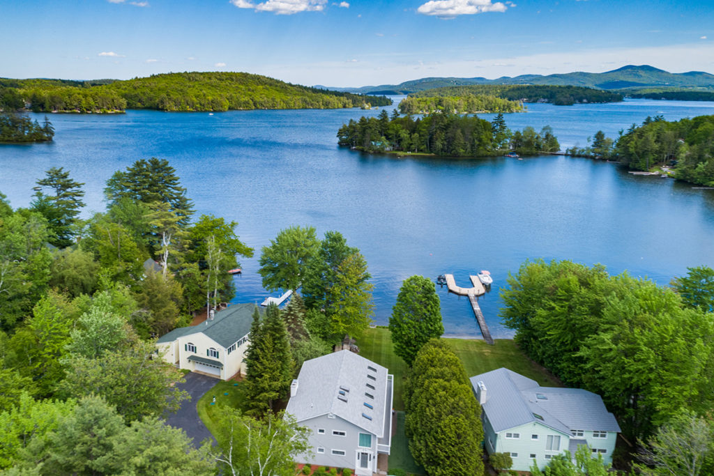 NH Lake Sales Activity - picture of lake with mountains and homes